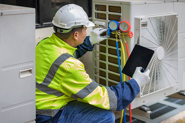 Professional Heat Pump Repair technician working in Justin, TX